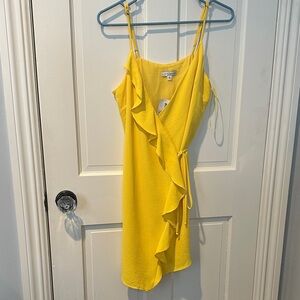 Ruffles yellow wrap mini dress.
